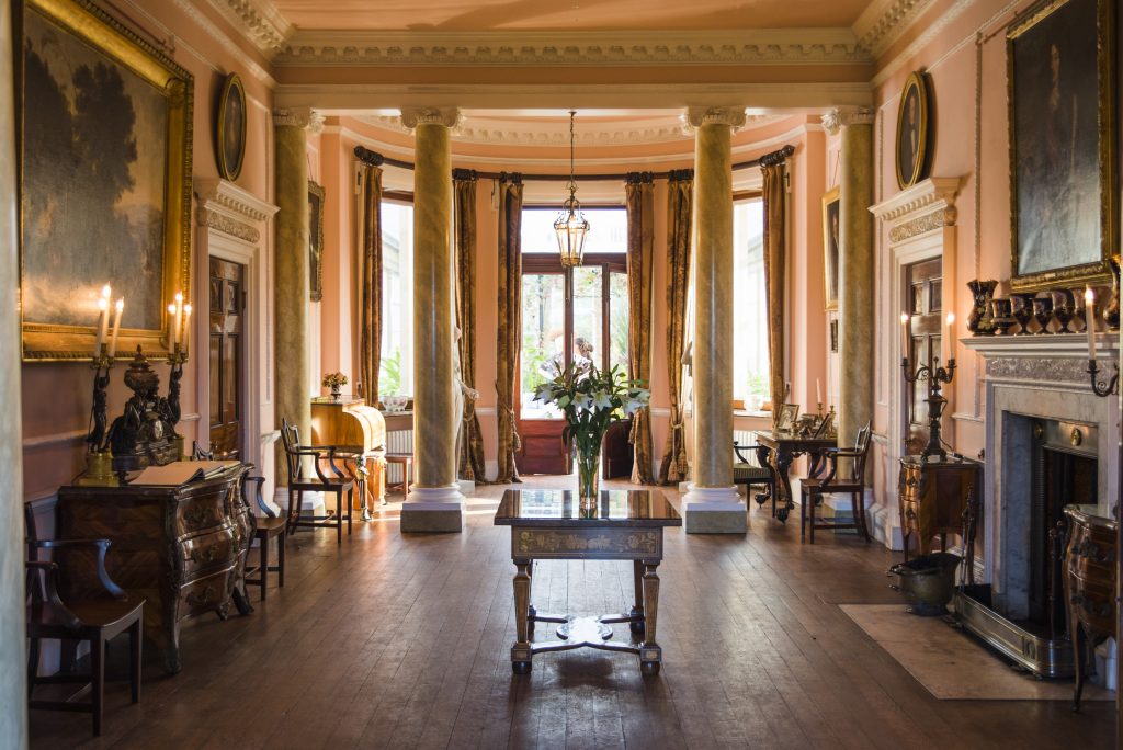 a living room filled with furniture and a large window