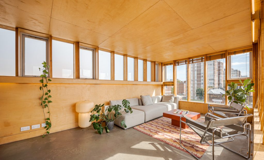 a room filled with furniture and a large window