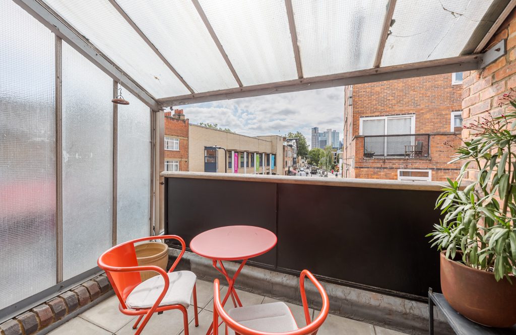 a chair sitting in front of a building
