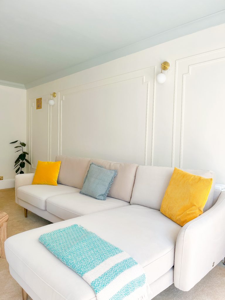 a bedroom with a bed and a chair in a room