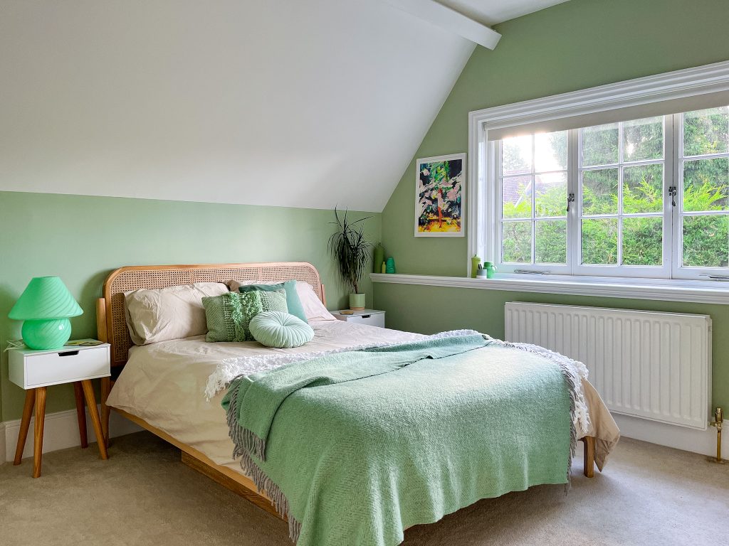 a bedroom with a bed in a room