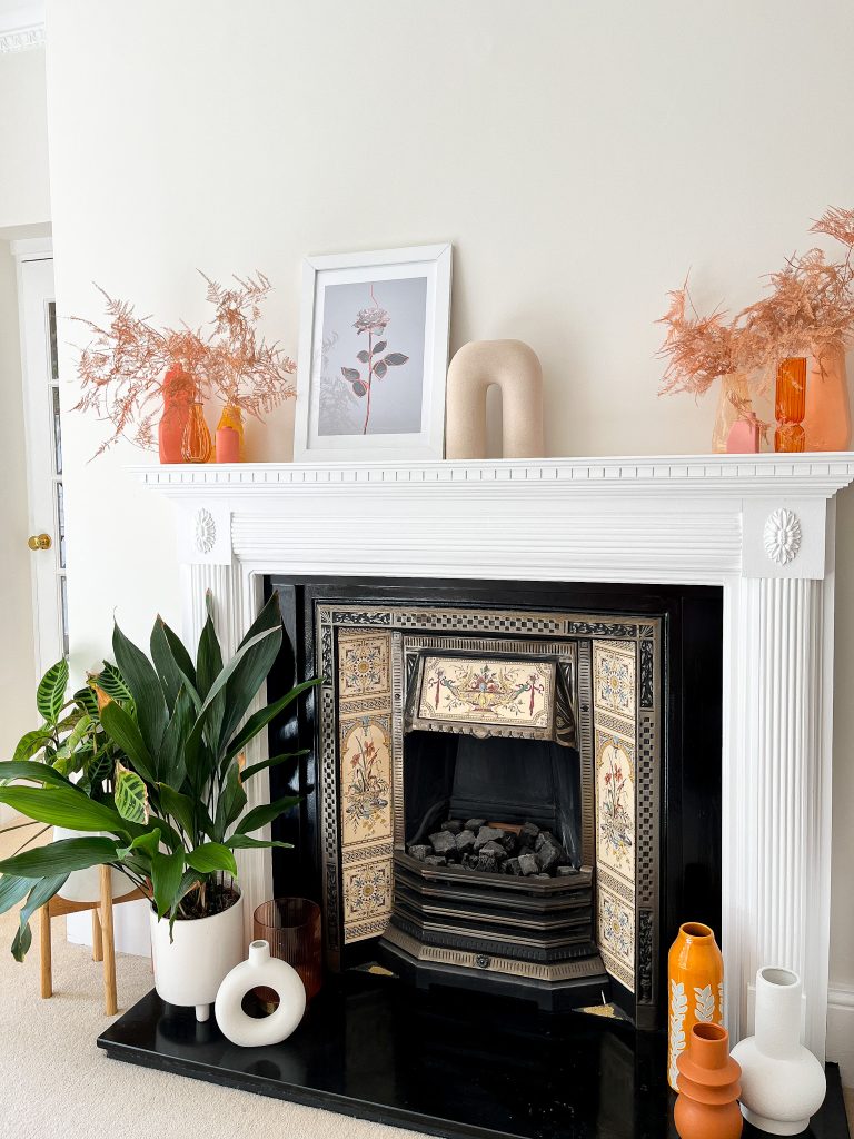 a fire place sitting in a living room filled with furniture and a fireplace