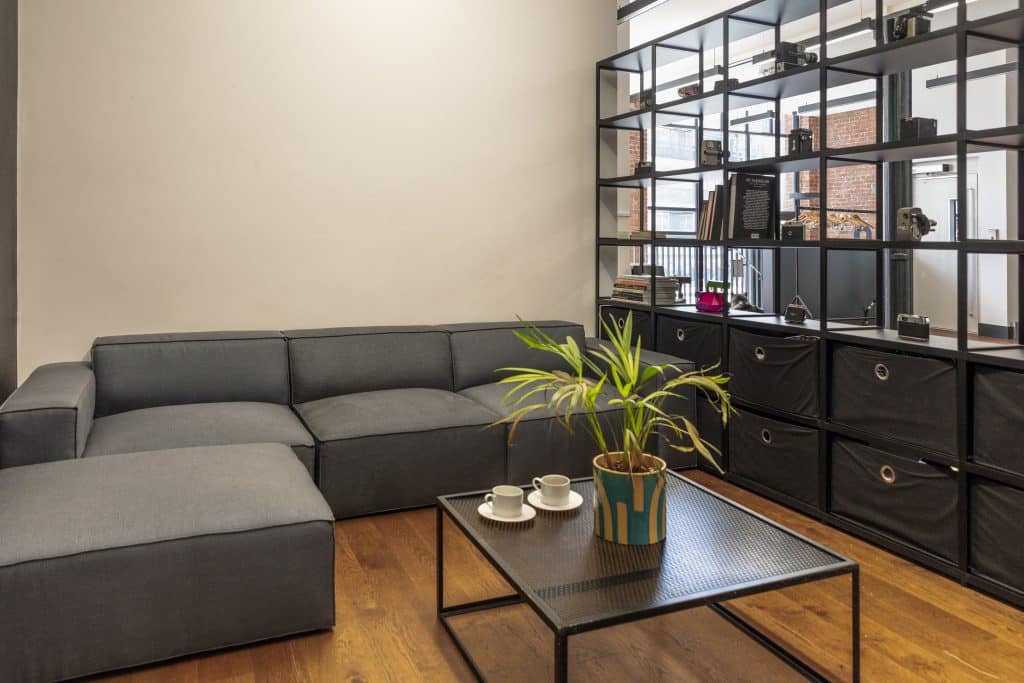 a living room filled with furniture and a large window