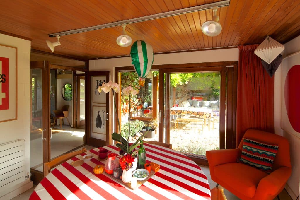 a living room filled with furniture and a large window