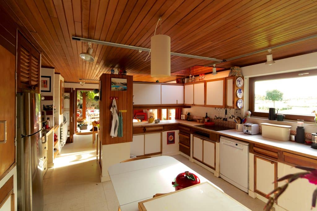 a kitchen with an island in the middle of a room