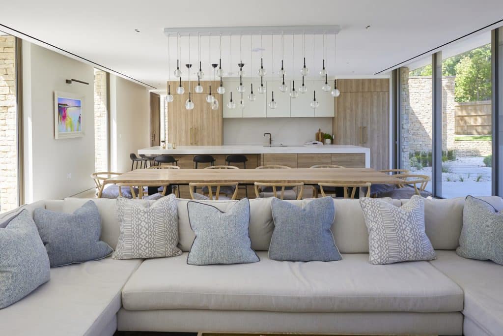 a living room filled with furniture and a large window