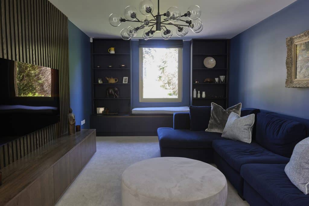 a living room filled with furniture and a large window