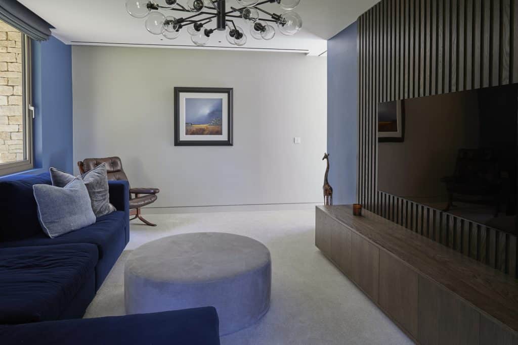 a bedroom with a bed and a couch in a living room