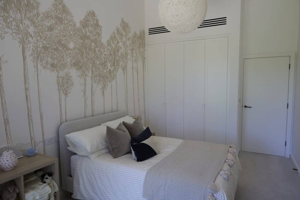 a bedroom with a bed in a room