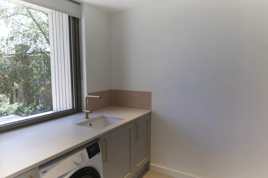 a room with a sink and a window