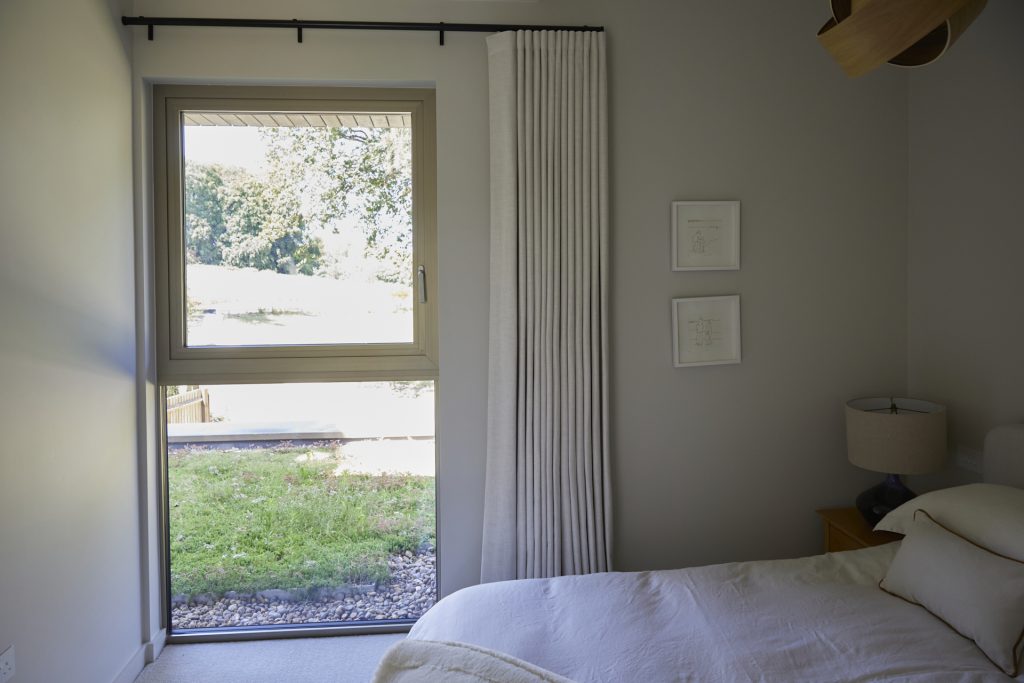 a bedroom with a bed and a window