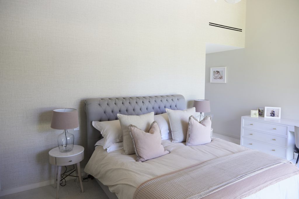 a bedroom with a large bed in a room