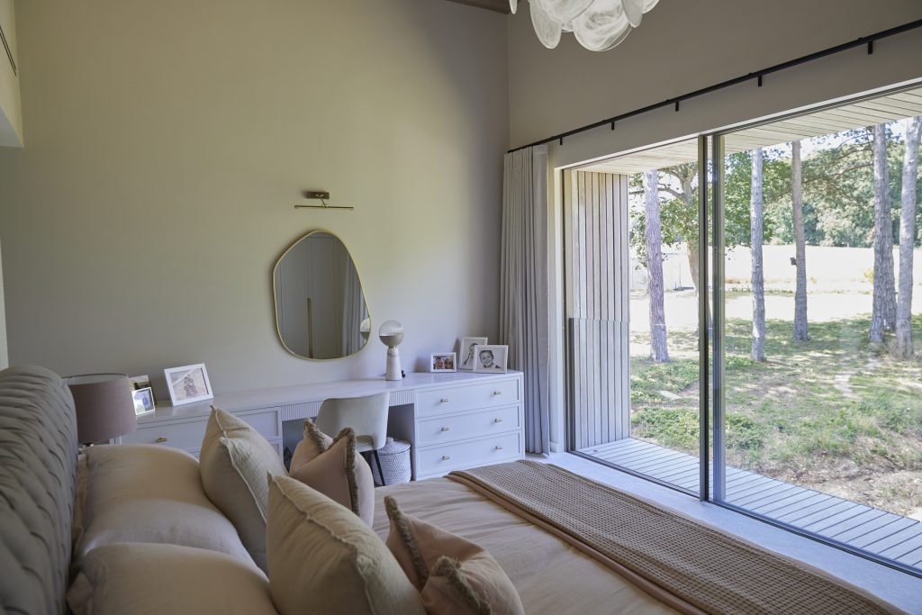 a bedroom with a view of a living room