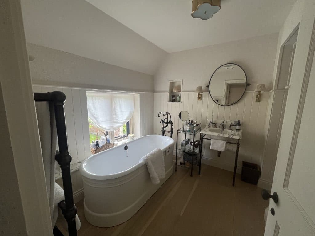 a room with a sink and a mirror