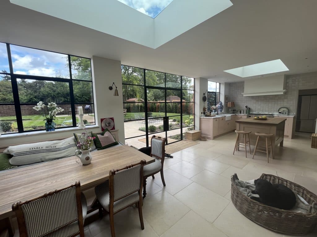 a room filled with furniture and a large window