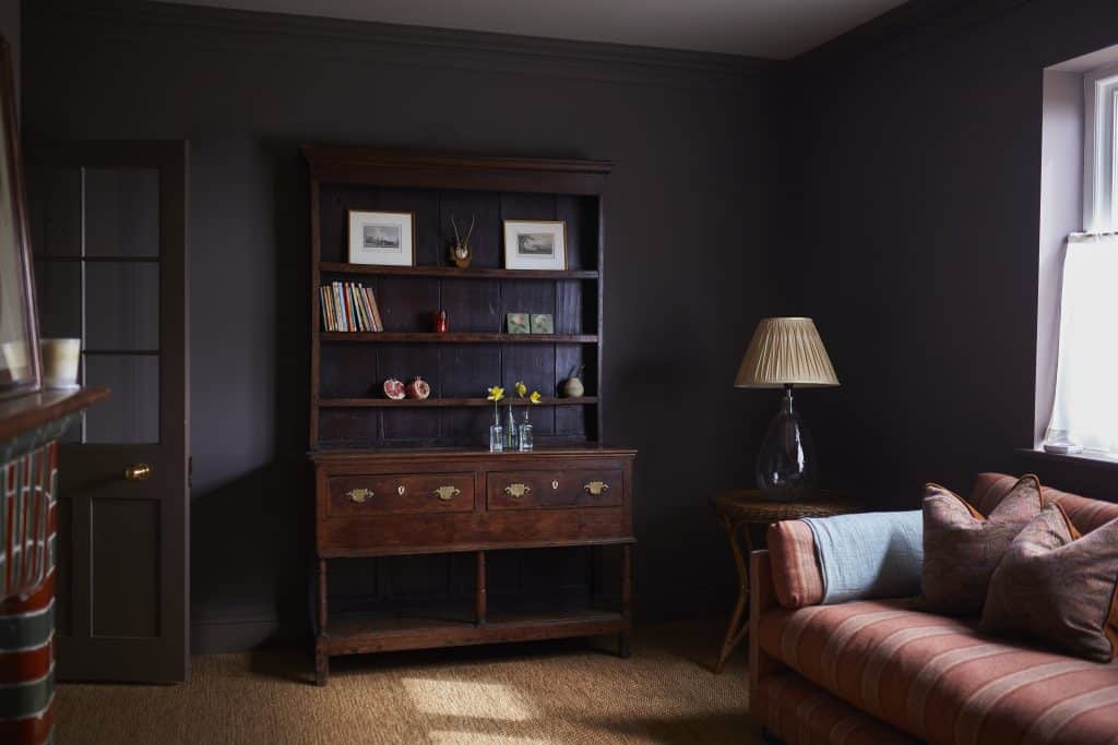 a living room filled with furniture and a flat screen tv