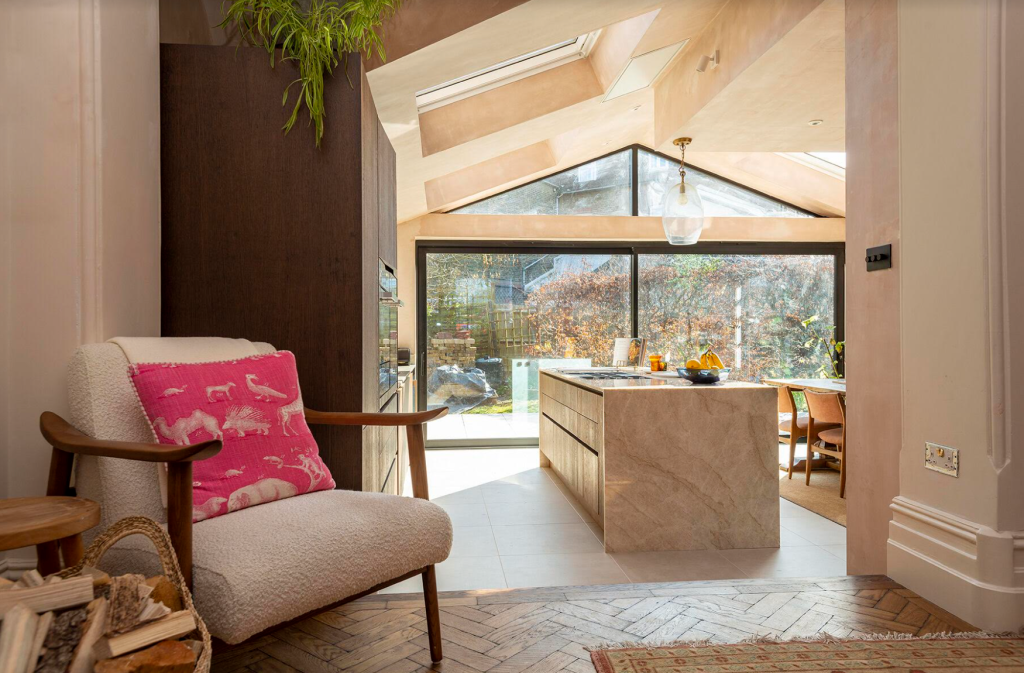 a living room filled with furniture and a large window