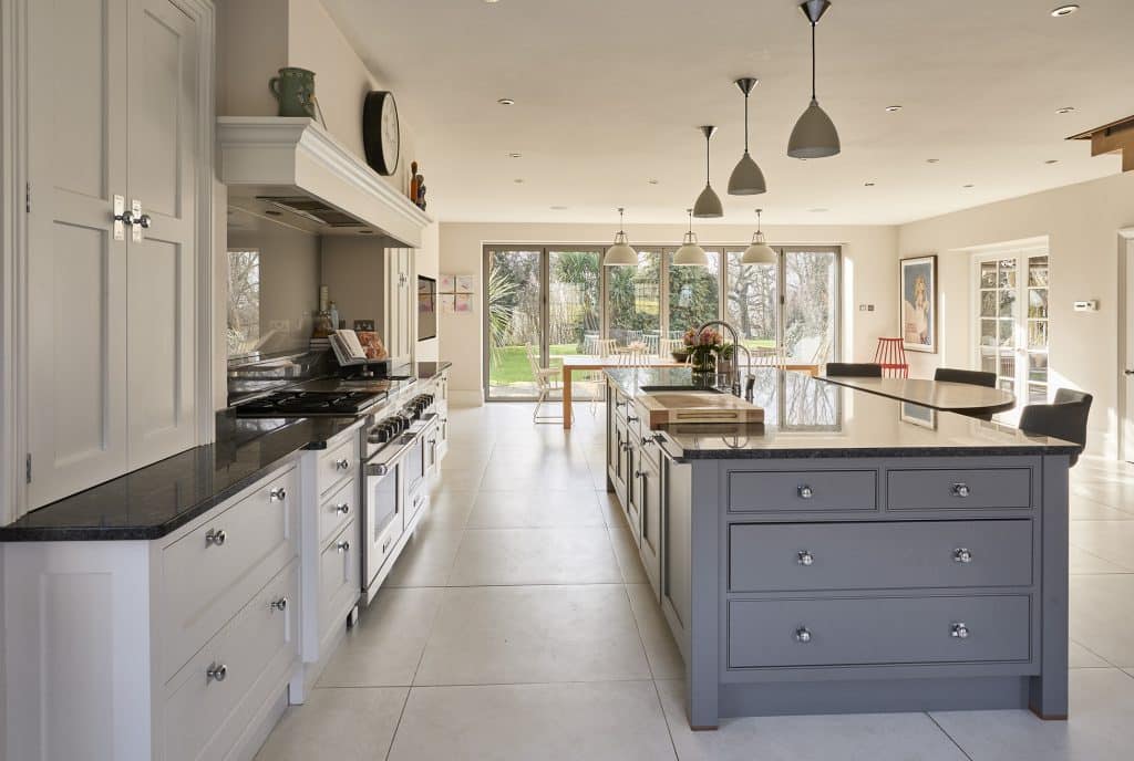 a kitchen area with a building in the background
