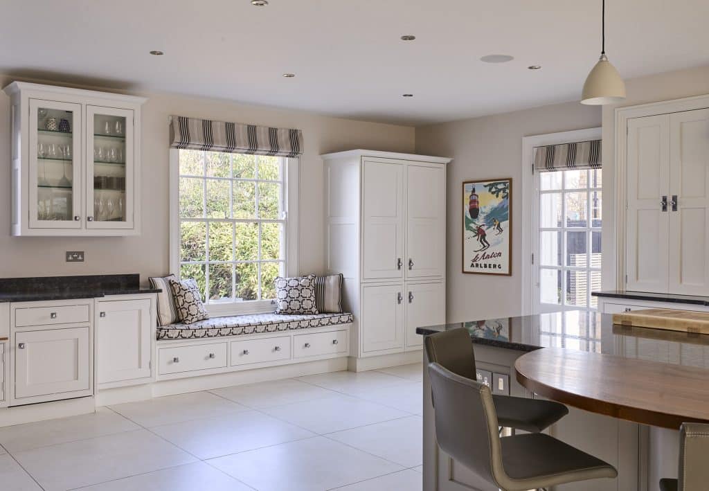 a room filled with furniture and a large window