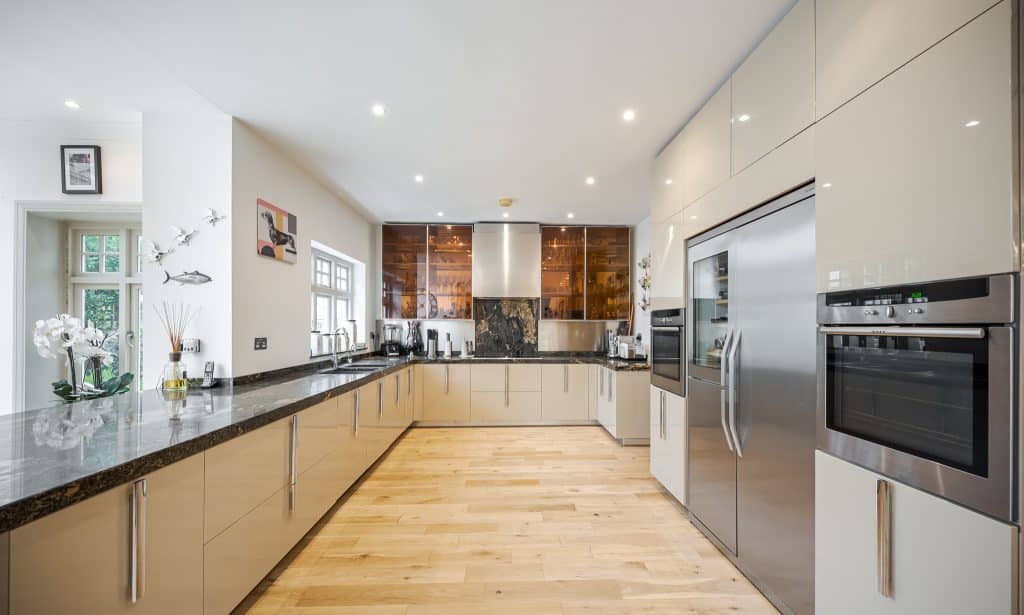 a kitchen with a sink and a counter in a room
