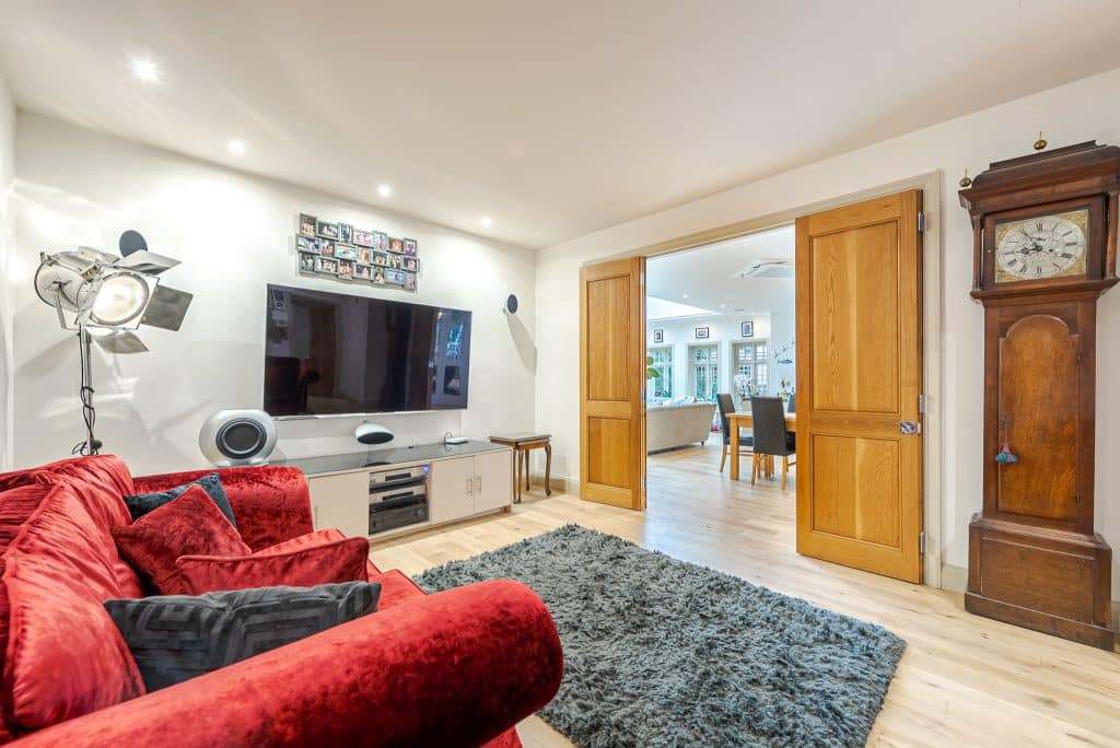 a bedroom with a view of a living room