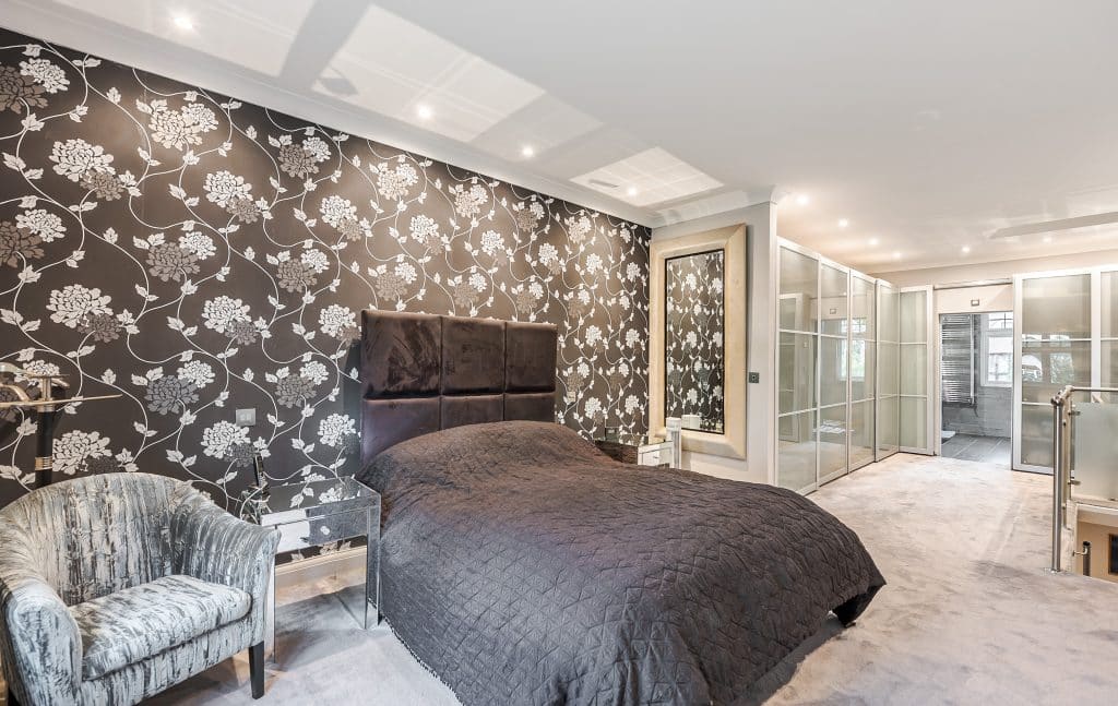 a bedroom with a large bed in a room