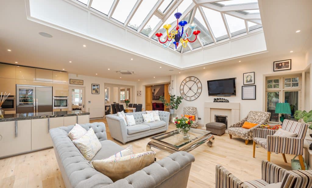 a living room filled with furniture and a fireplace
