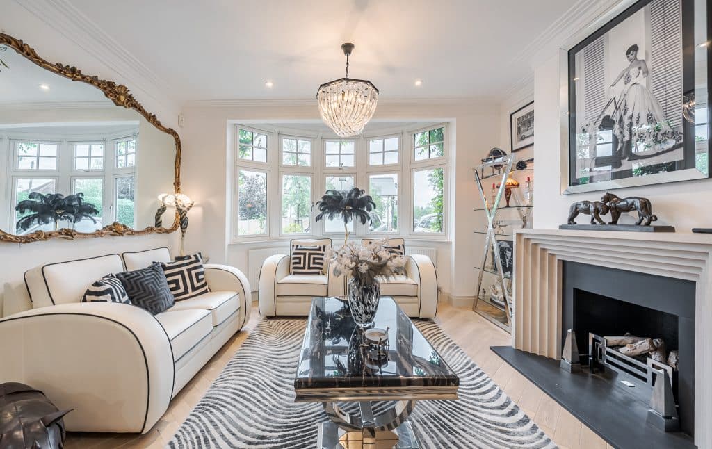 a living room filled with furniture and a fire place