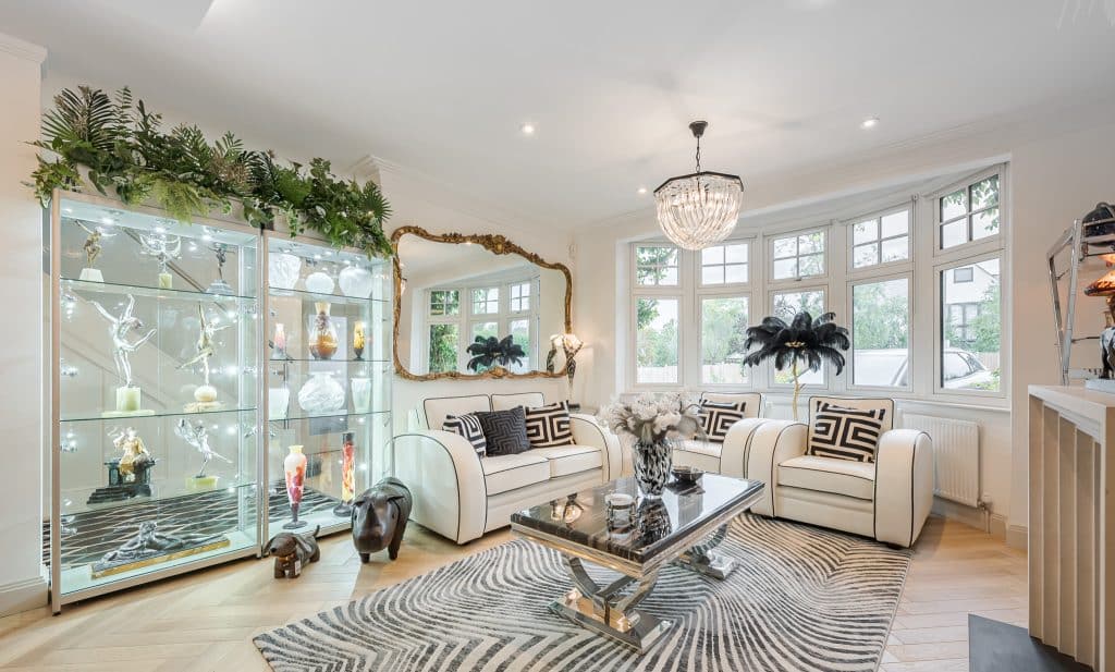 a living room filled with furniture and a large window