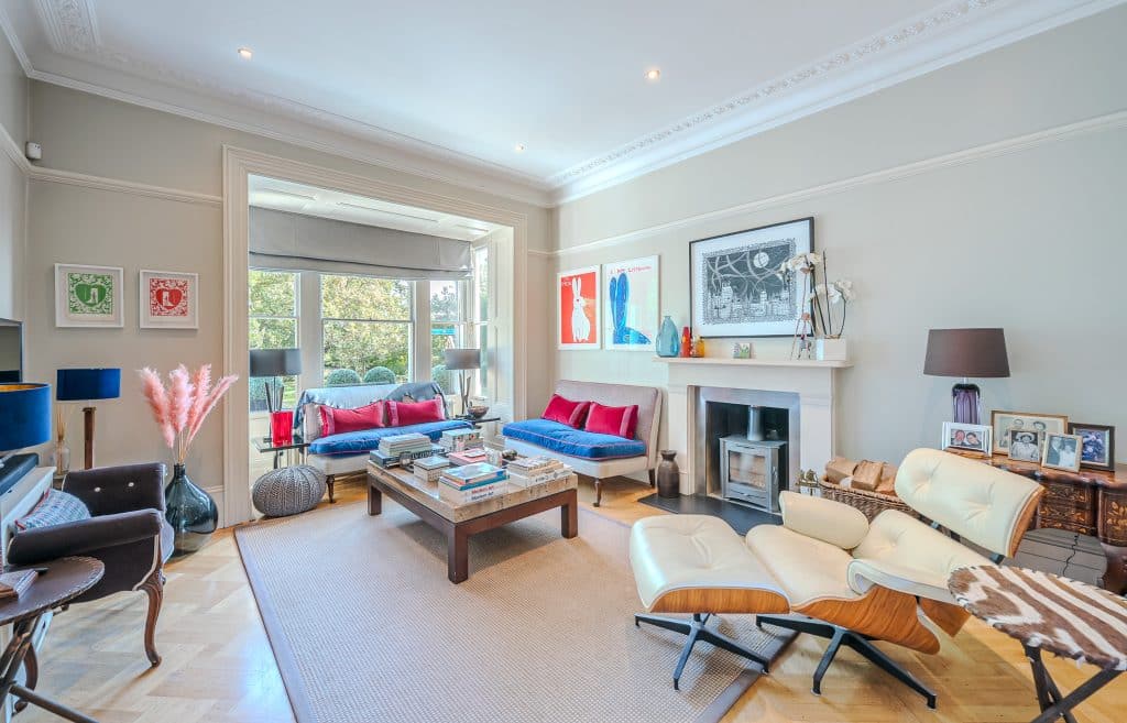 a living room filled with furniture and a large window