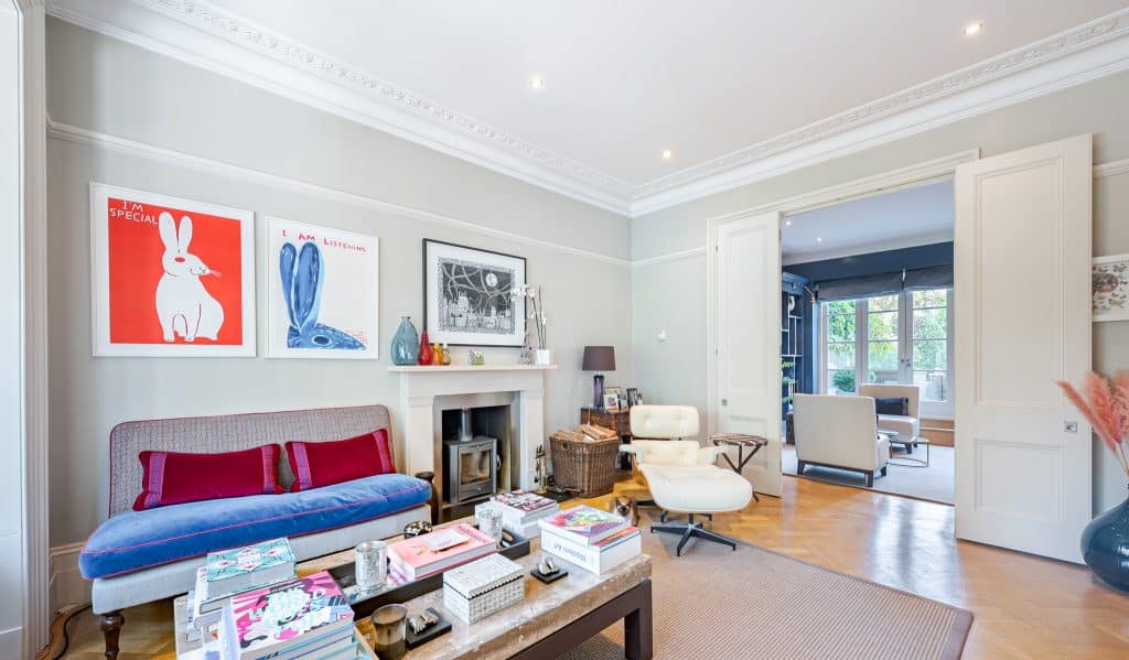 a living room filled with furniture and a flat screen tv