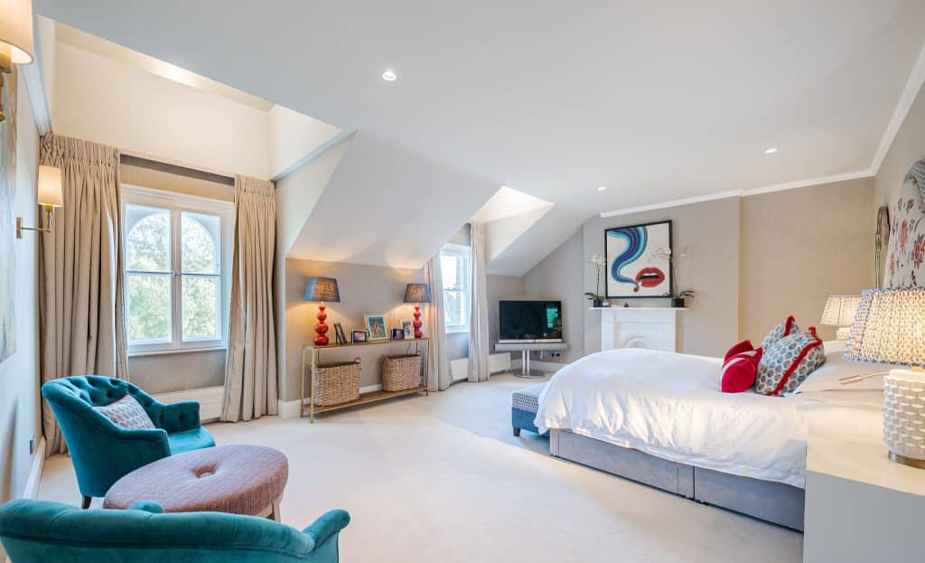 a living room filled with furniture and a large window