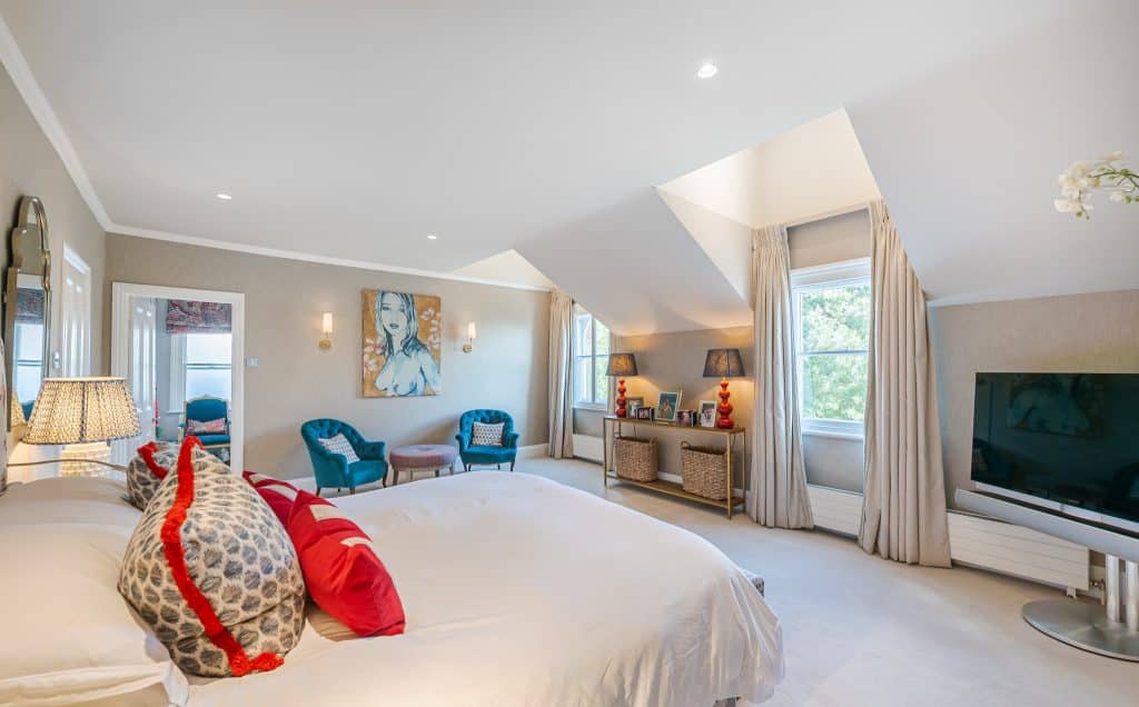 a bedroom with a large bed in a room