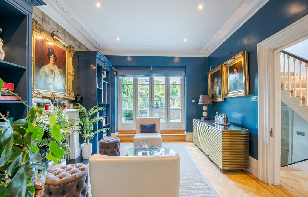 a room filled with furniture and a large window