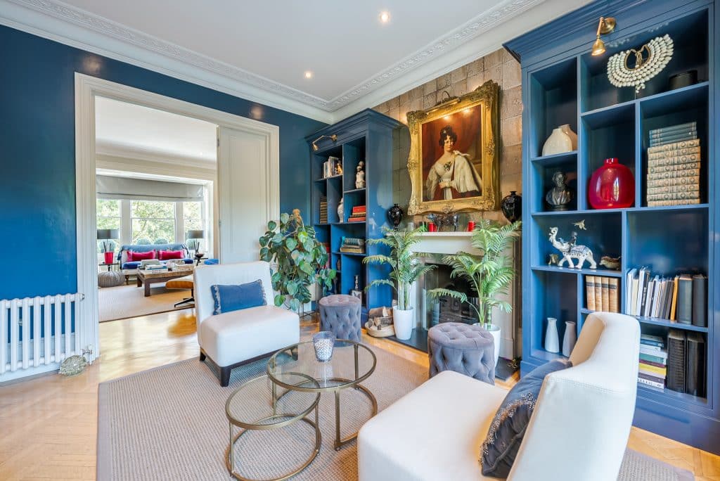 a living room filled with furniture and a fire place