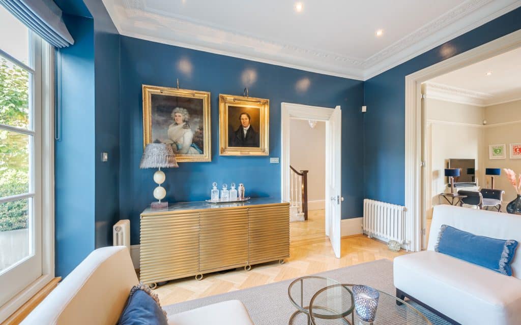 a living room filled with furniture and a large window