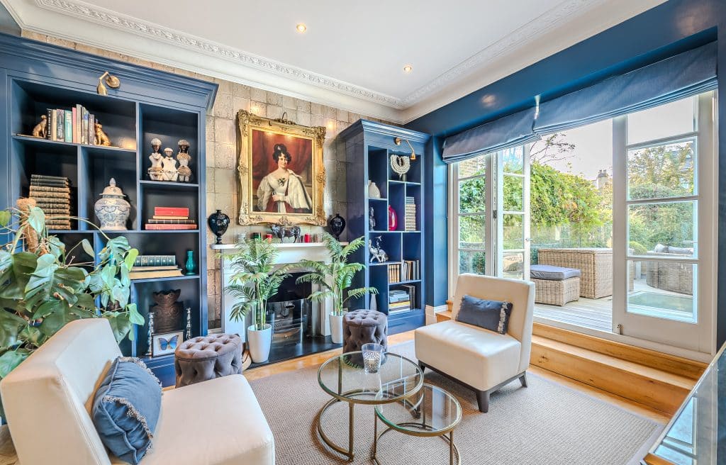 a living room filled with furniture and a fire place