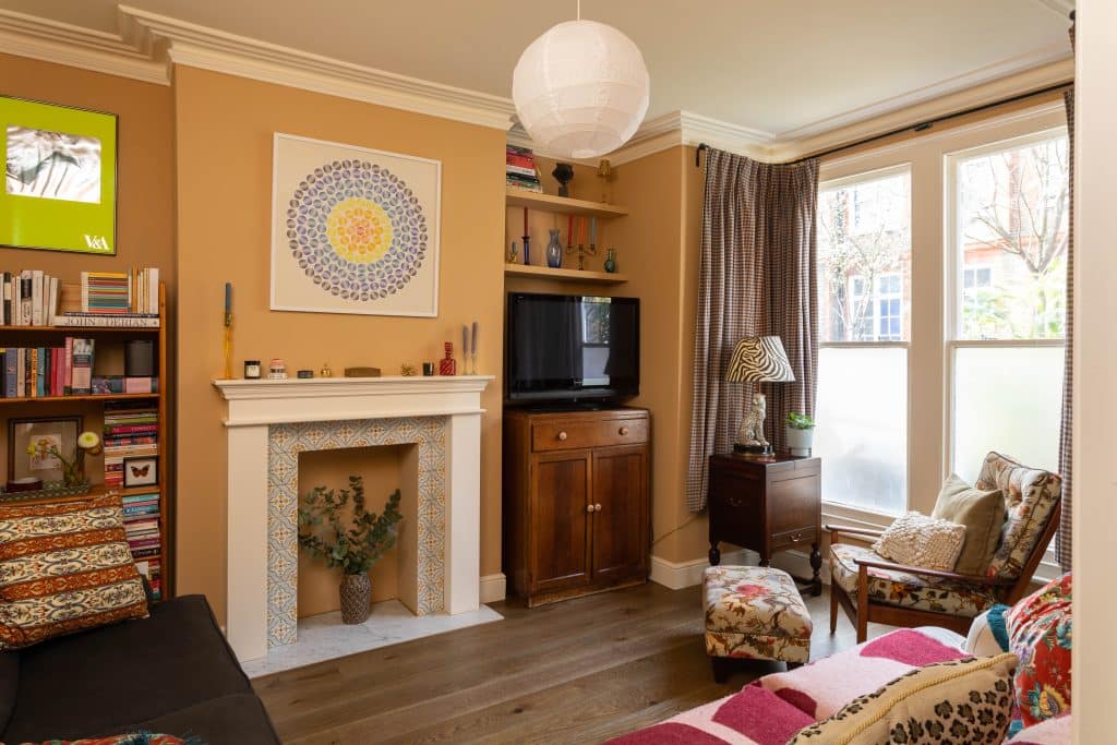 a living room filled with furniture and a fire place