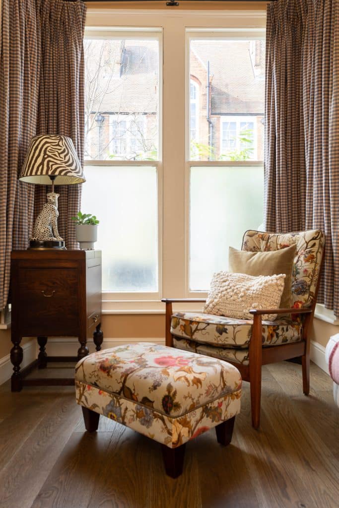 a bedroom with a bed and desk in a small room