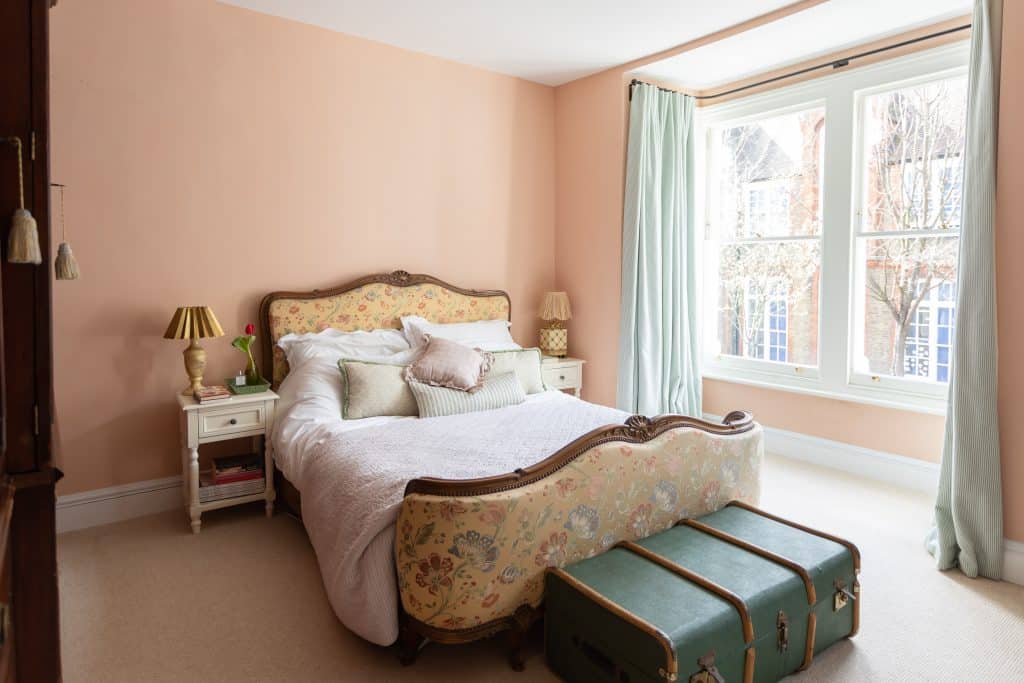 a bedroom with a bed in a room