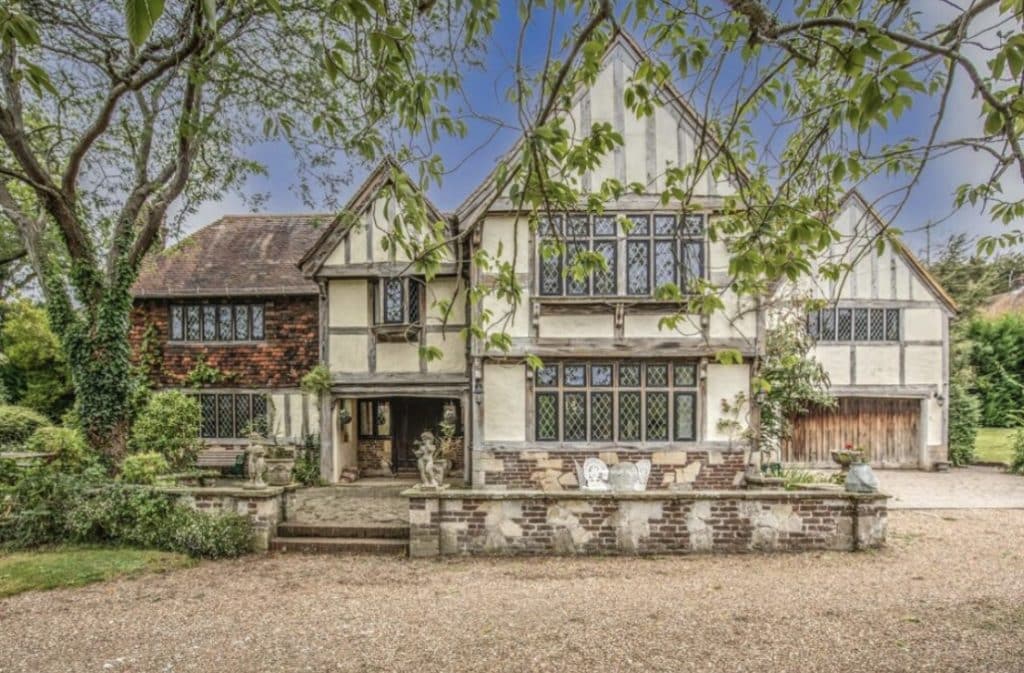 a tree in front of a house