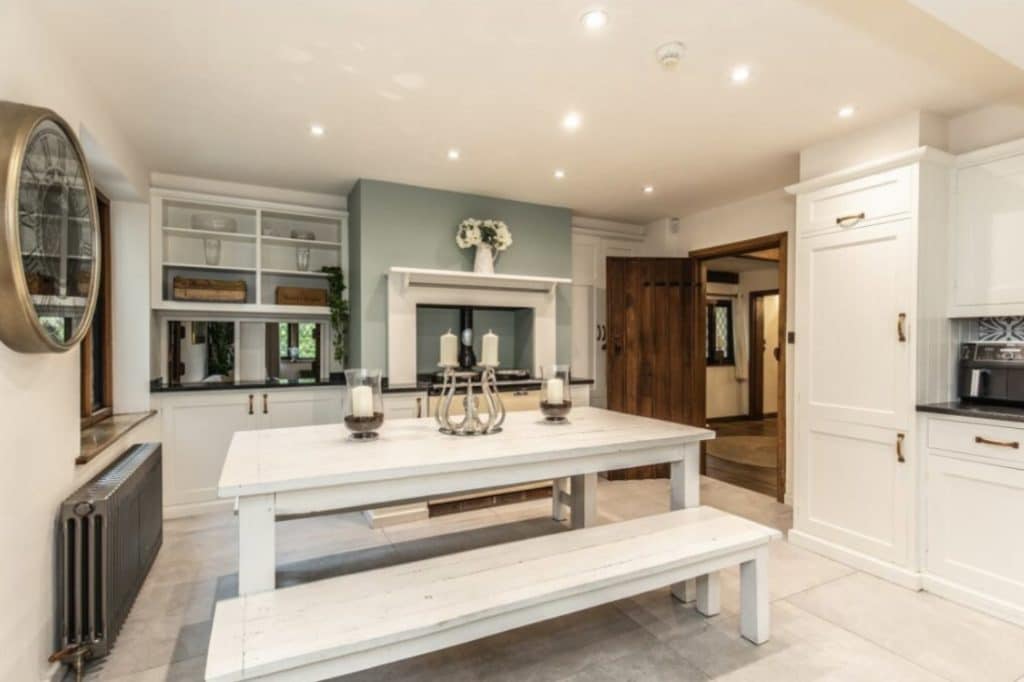 a kitchen with an island in the middle of a room