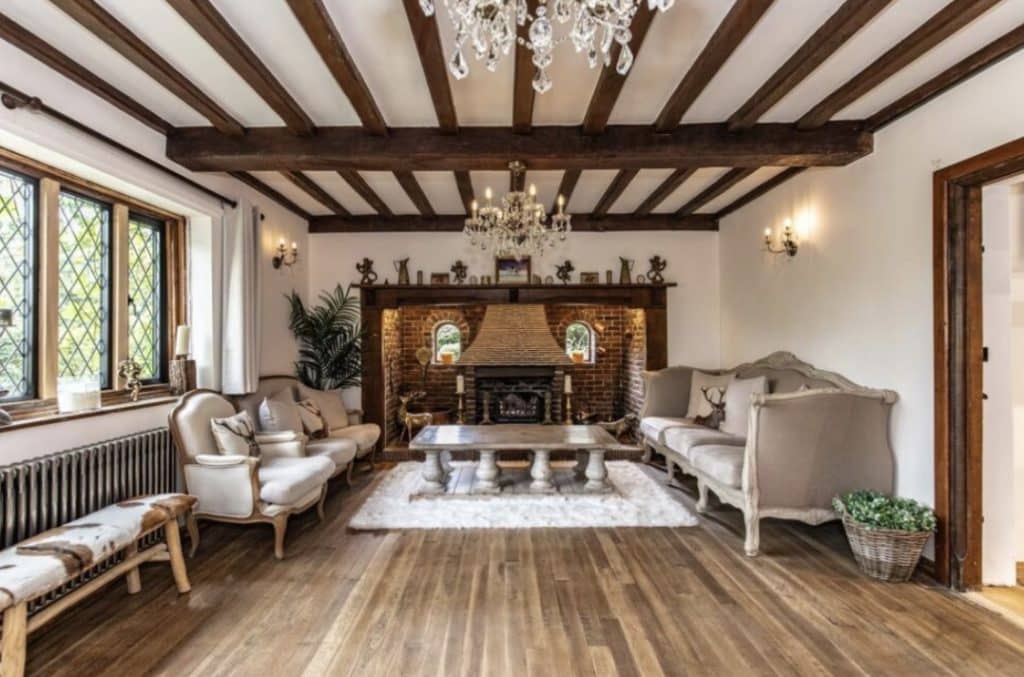 a living room filled with furniture and a fireplace