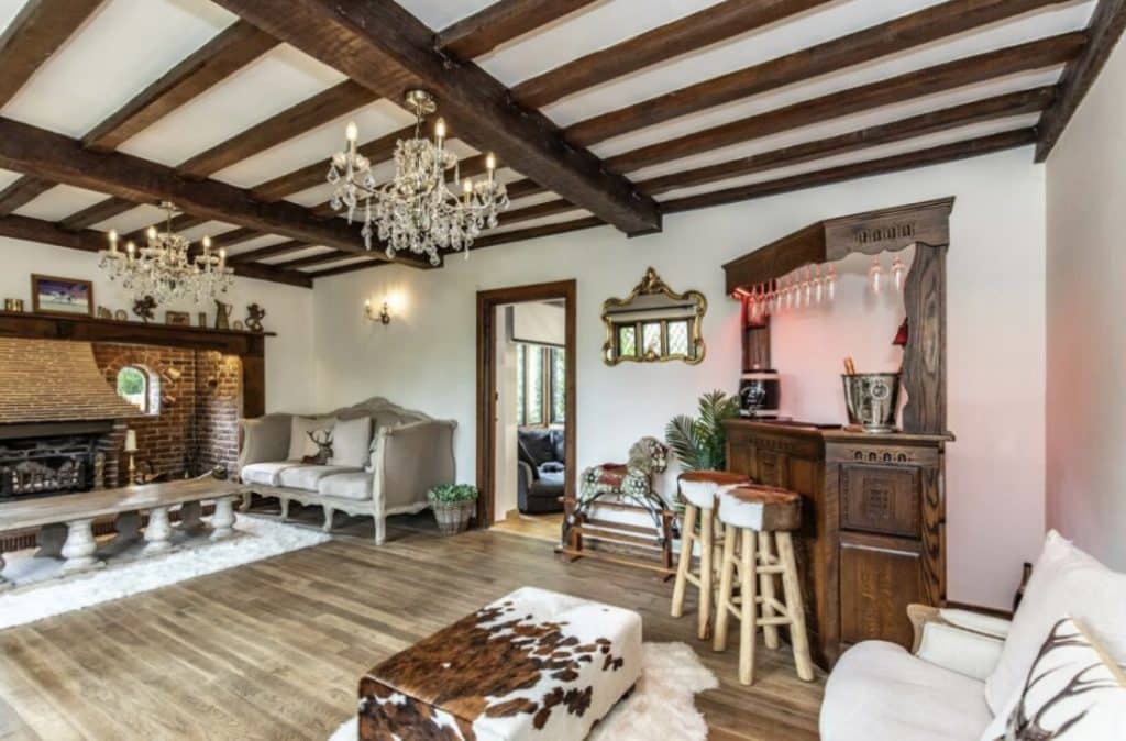 a living room filled with furniture and a fireplace