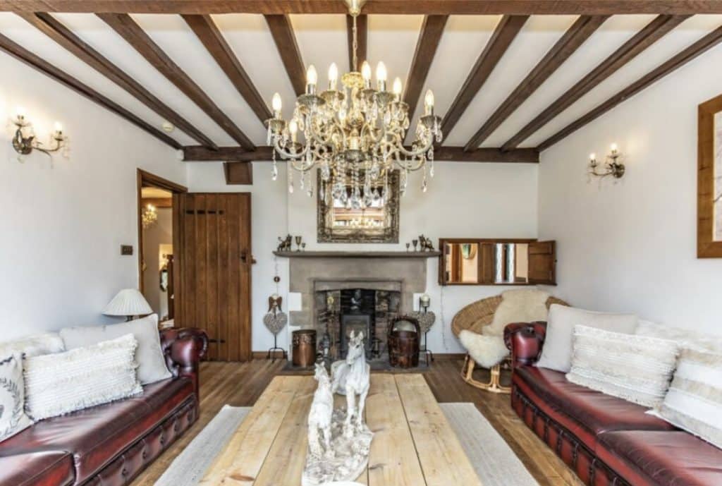 a living room filled with furniture and a fire place