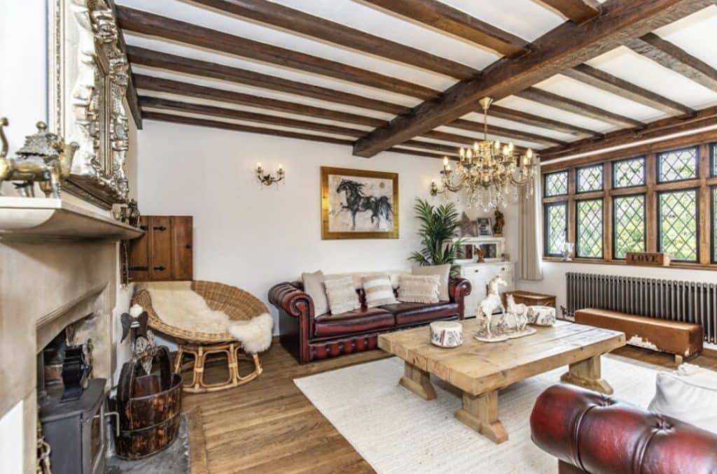 a living room filled with furniture and a fireplace