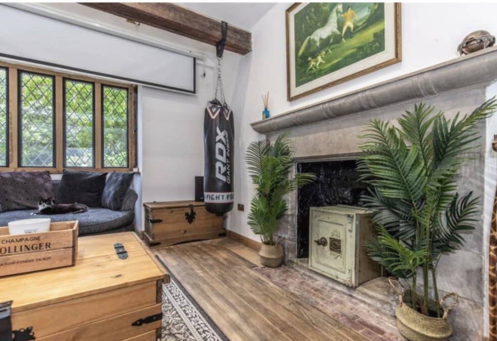 a living room filled with furniture and a fire place