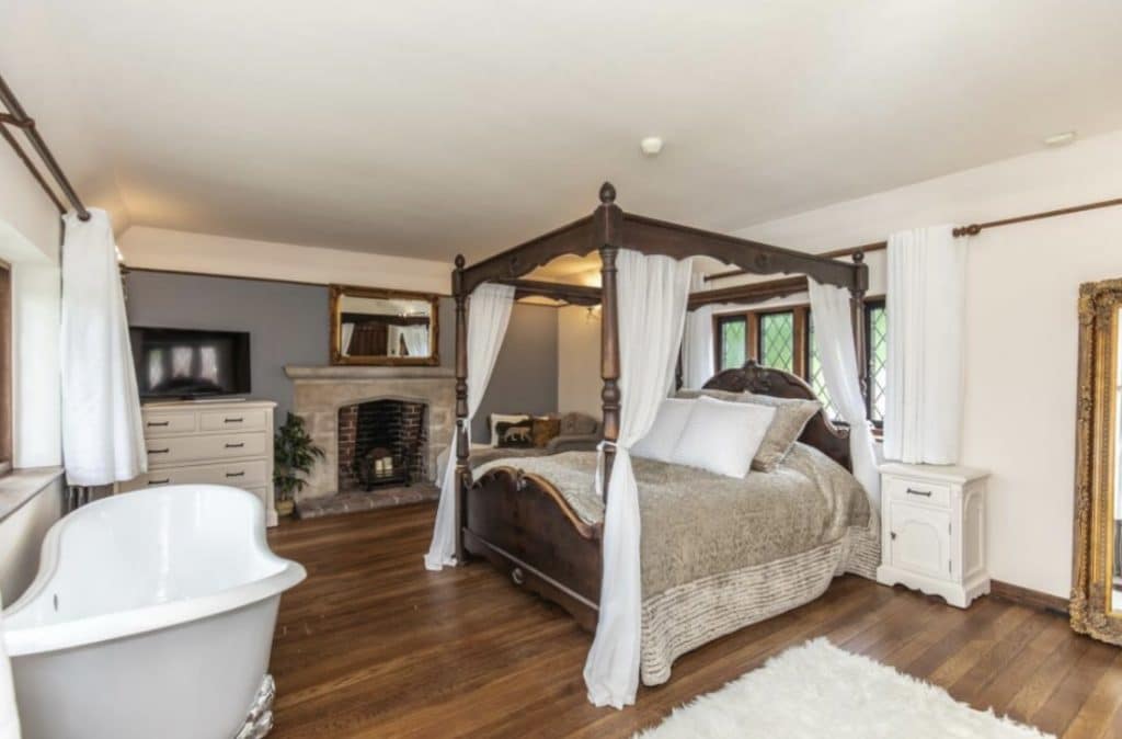 a living room filled with furniture and a large window