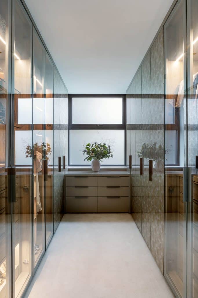 a bedroom with a large window