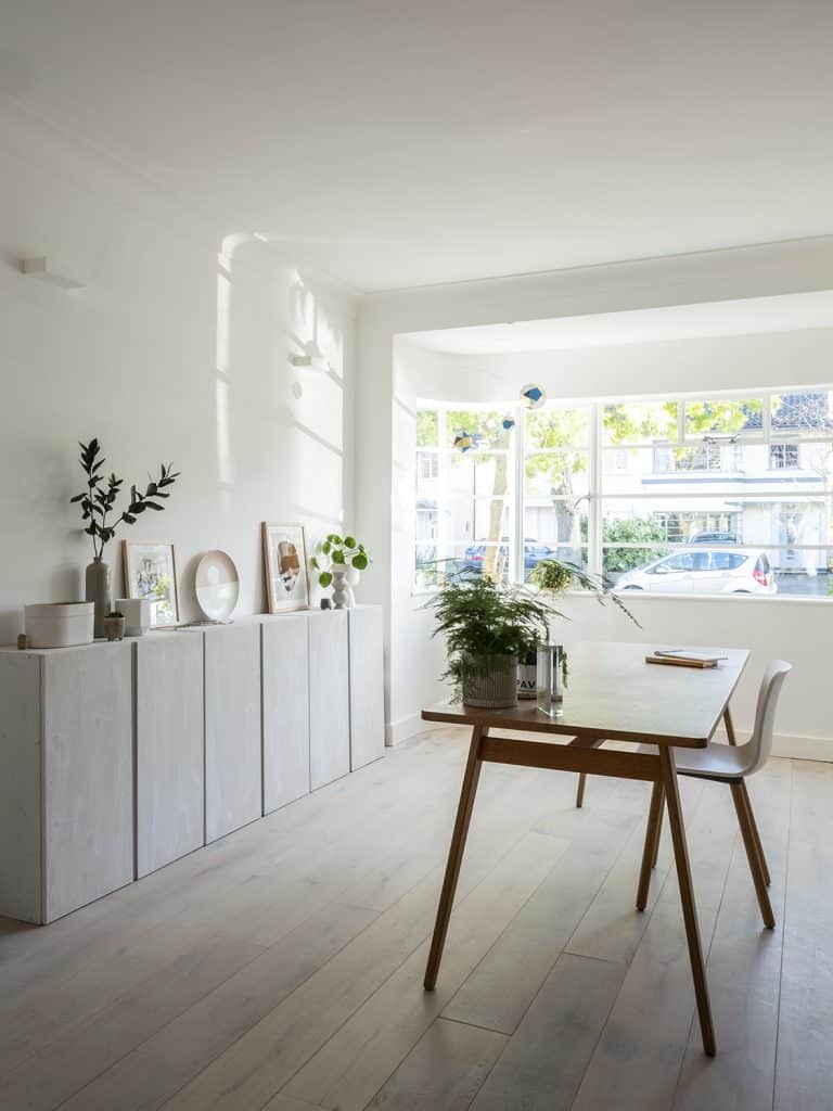 a room filled with furniture and a large window